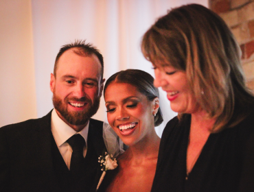 officiant and happy married couple